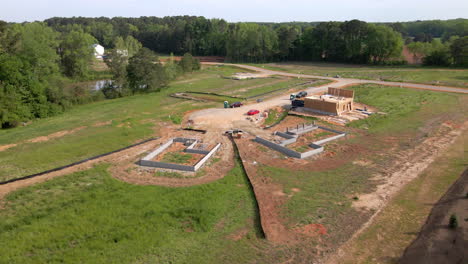Drone-shot-of-homes-being-built,-new-construction