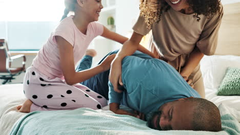 family tickling fun in the bedroom