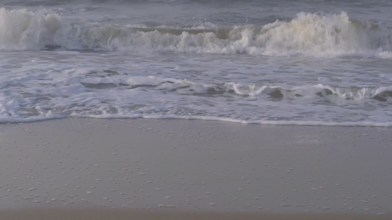 Waves of the Caribbean Sea breaking on the beach