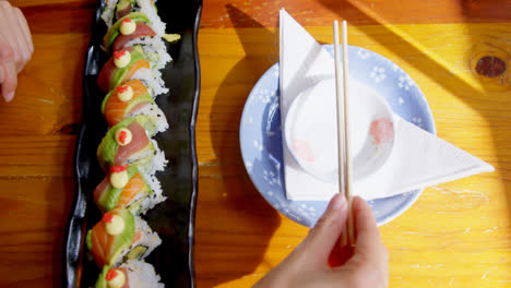 woman having sushi in restaurant 4k