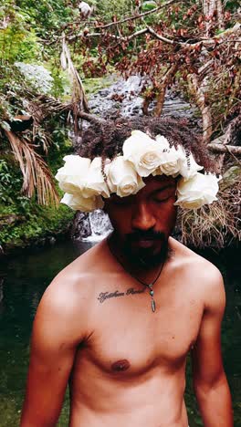 man with rose crown in nature