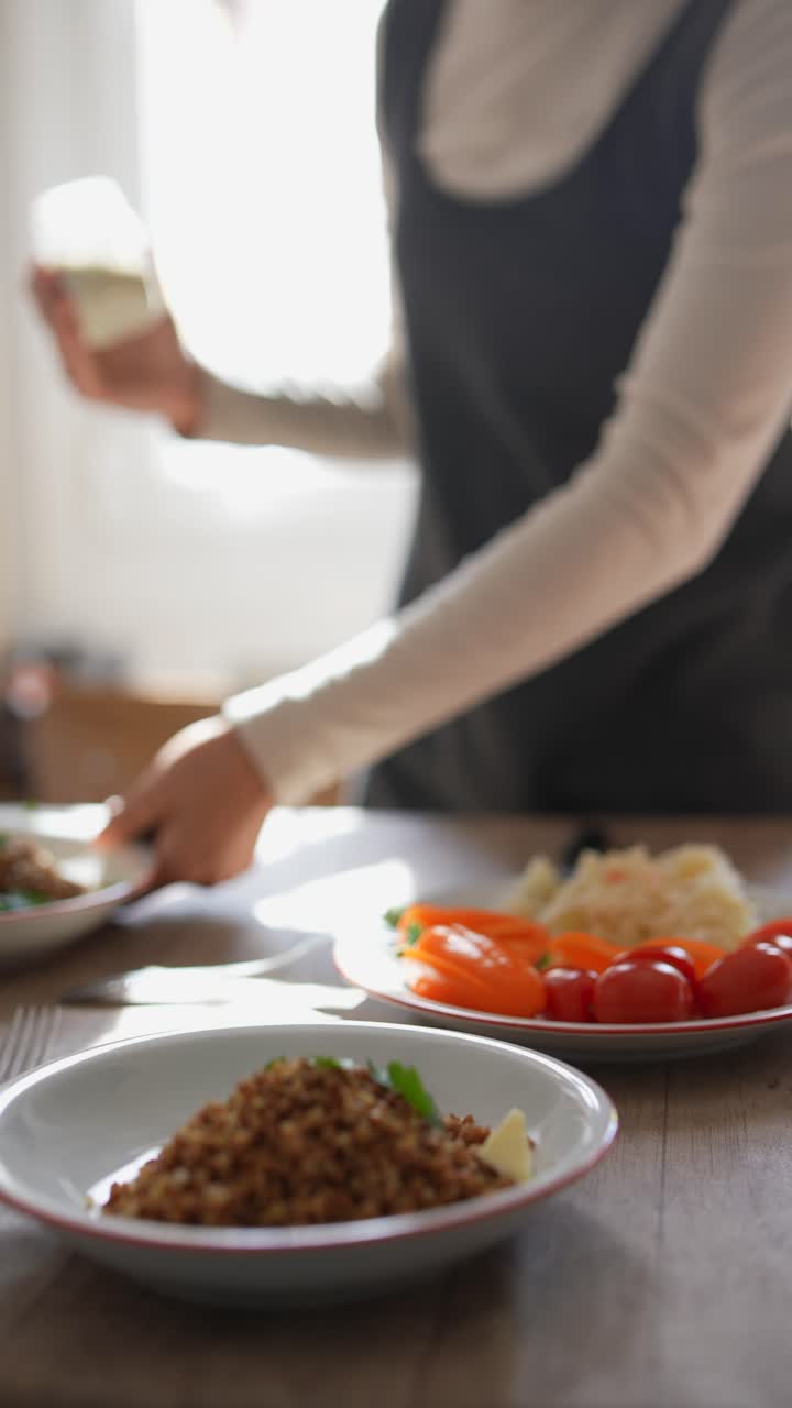 Woman preparing a buckwheat meal with vegetables