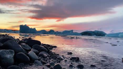 majestic rainbow colored sunset in jokusarlon glacier lagiin iceland - wide shot