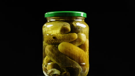 pickled cucumbers in a jar