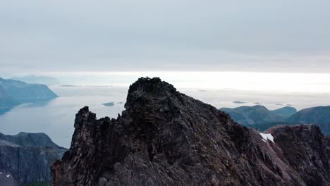 black mountain peak in kvænan in norway - aerial