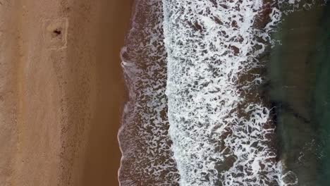 Breathtaking-aerial-drone-flight-bird's-eye-view-drone-shot-sea-wave-brown-sand-on-lonely-empty-Paradise-wild-nature-dream-beach-Corfu-Greece-autumn-2021