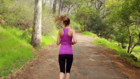 Woman-jogging-in-the-forest