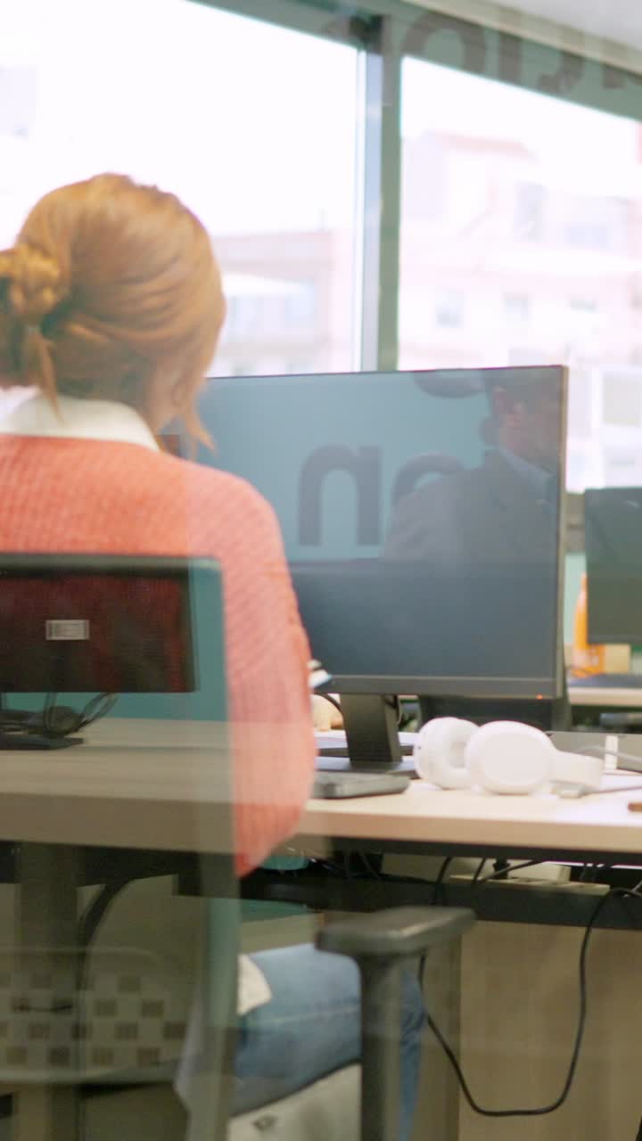 Coworkers standing up and leaving the office