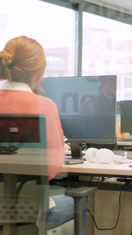 coworkers standing up and leaving the office