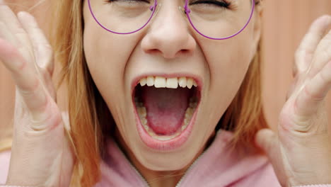 woman with open mouth and purple glasses