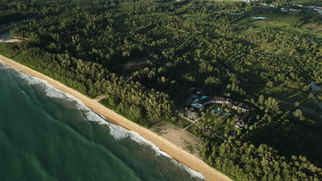 aerial helicopter shot spiraling over the pristine coastlines of khao lak, thailand