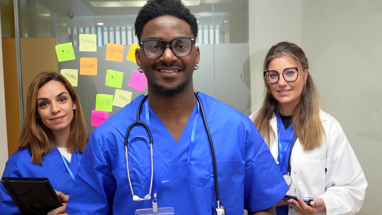 Diverse Medical Team Standing Together in Hospital Office