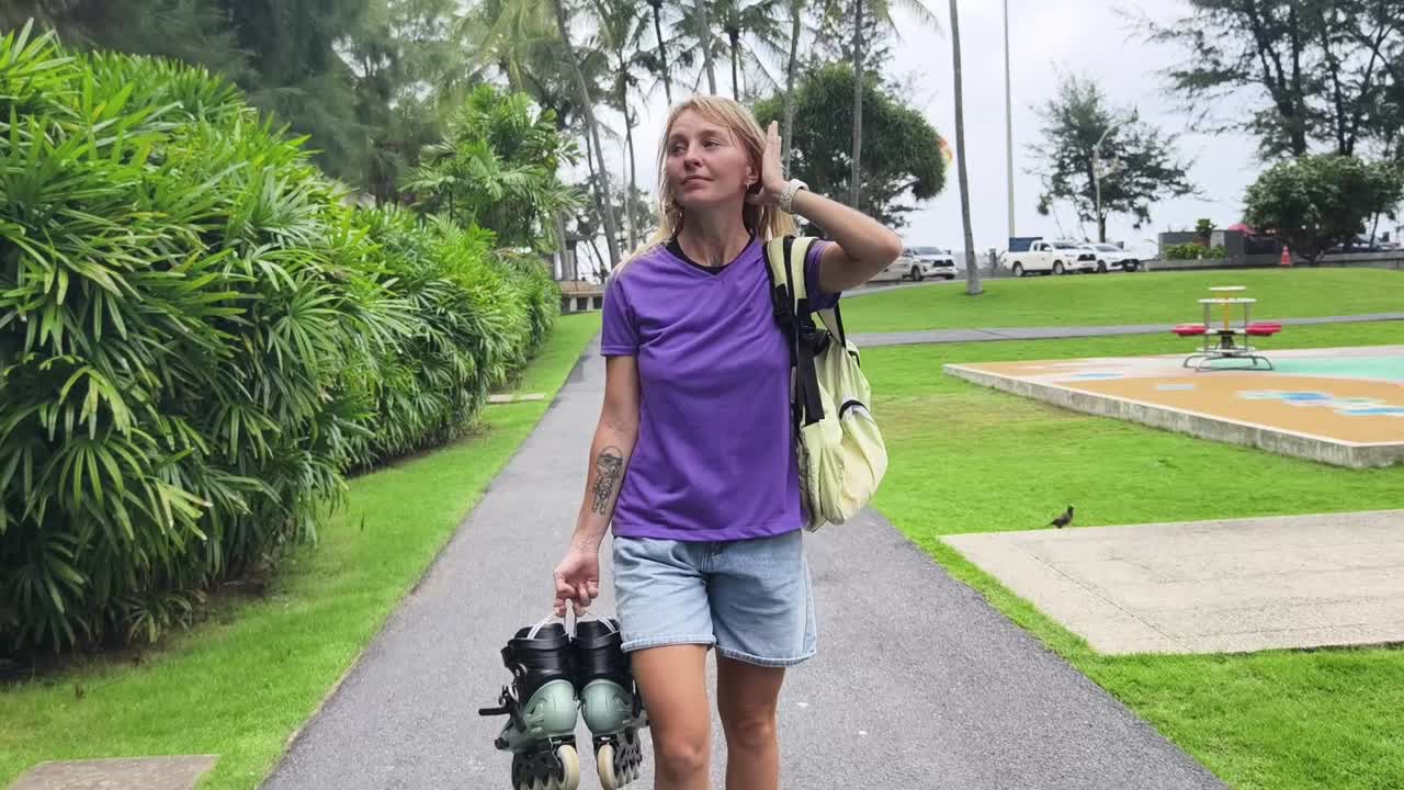 Woman Walking with Roller Skates in a Park