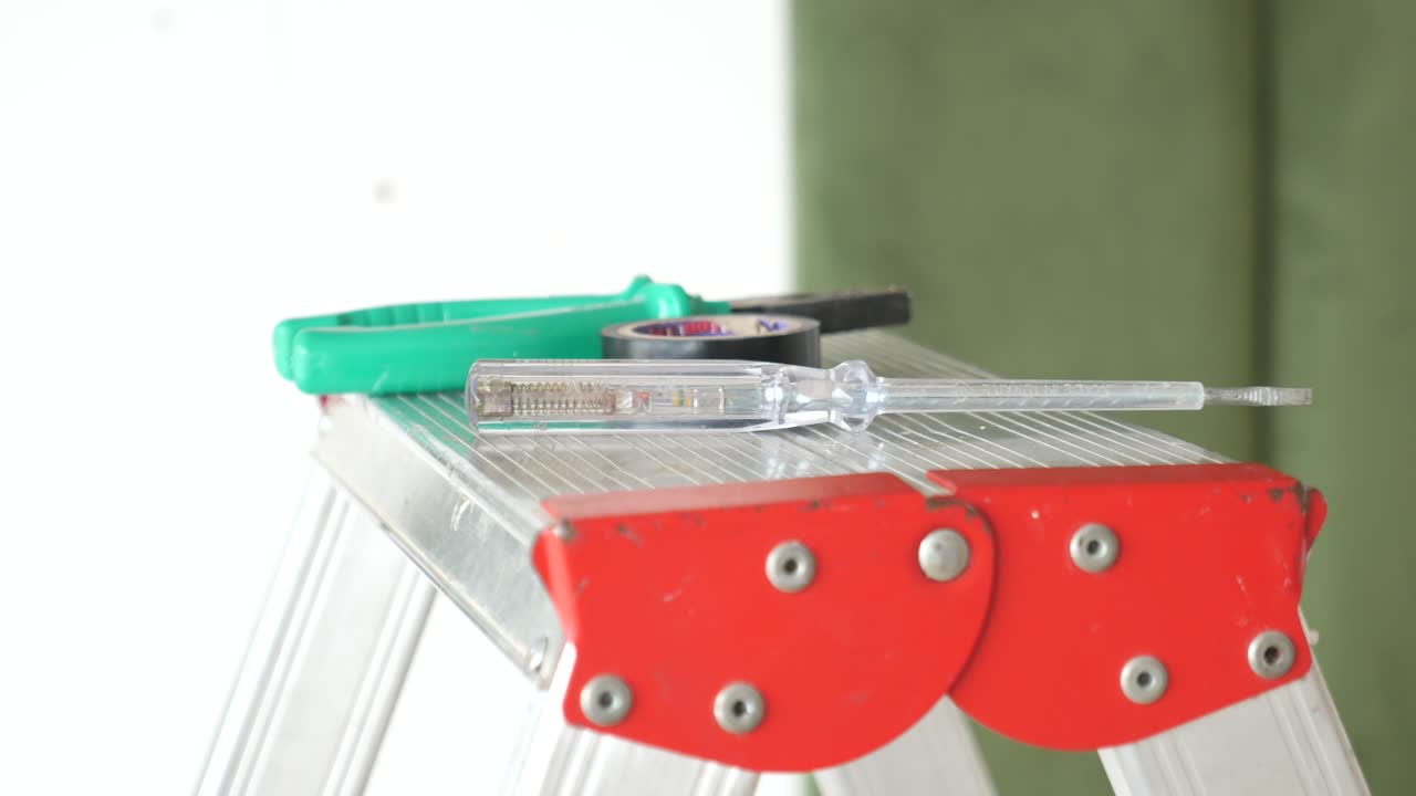 Electrical tools on a ladder