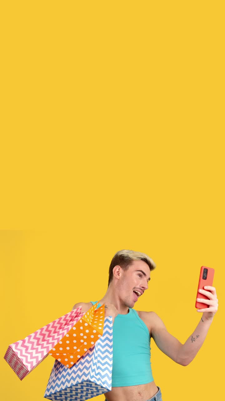 Man with shopping bags and cell phone