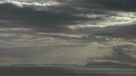 dark storm clouds amass over the ocean