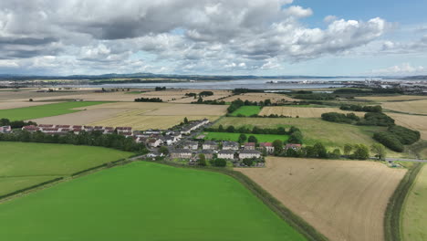 4K-Aerial-orbit-over-Scottish-Country-Town-just-outside-of-Edinburgh,-The-Capital-of-Scotland,-United-Kingdom