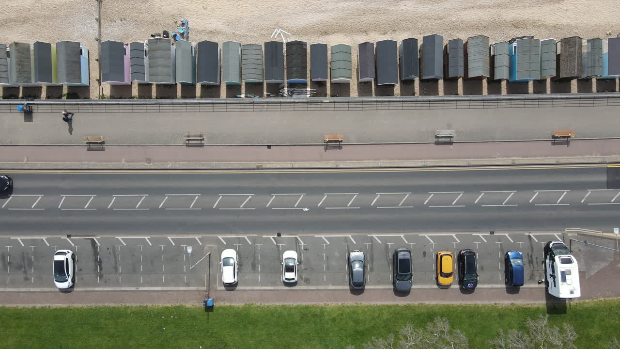 Aerial Beach Shot. Drone Over Beach And Road. 4k Stock Video Aerial View Of Cars And Sandy Beach Scene.