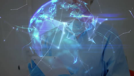 female medical professional holding tablet in clinic, projecting blue holographic globe network