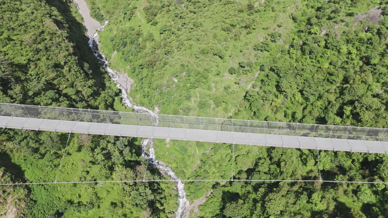 Hanging Bridge of Nepal with mountain and River