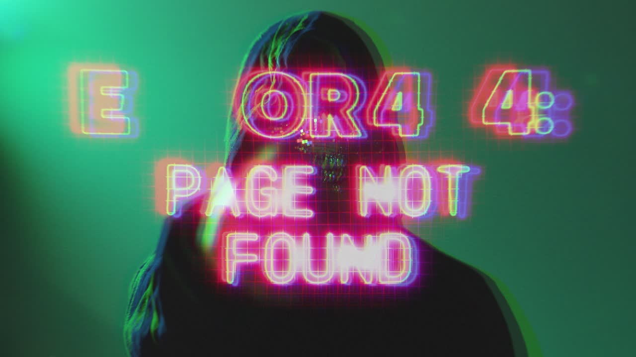 Anonymous hacker in a dark room wearing hoodie and mask typing on laptop with glowing error 404 warning screen. Strong concept for cybercrime and online fraud visuals