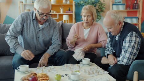 senior citizens enjoying a game at home