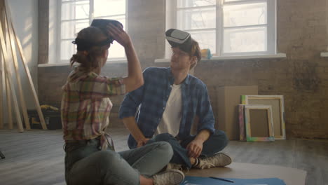 family in vr glasses sitting on floor during home repair. redesign concept.