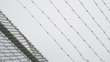 Barbed-wire-with-cloudy-sky-in-the-background