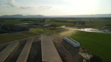 Trucks-kicking-up-smoke-on-farm