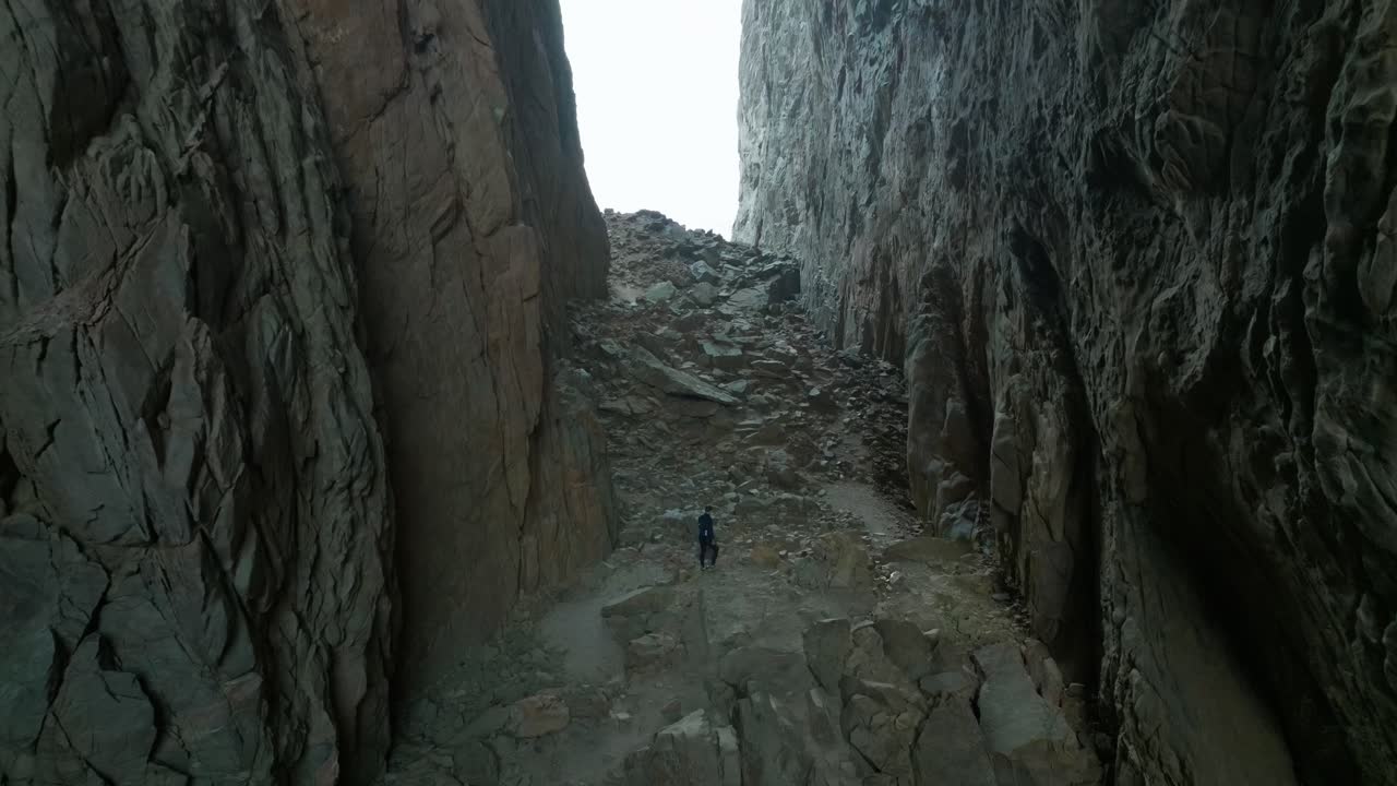 Torghatten in Norway person walking inside the hole through the mountain