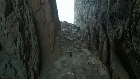 torghatten in norway person walking inside the hole through the mountain