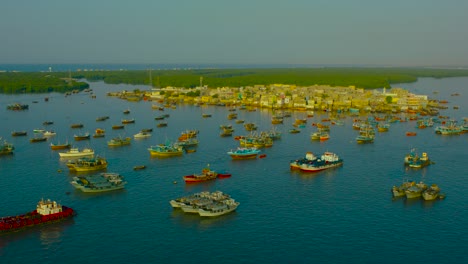 a busy port with ships of fishermen