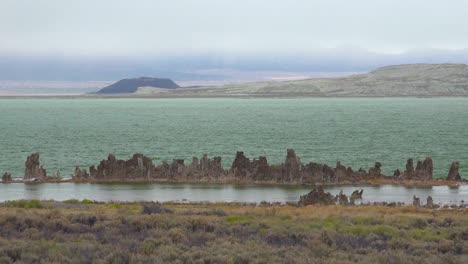 calcium formations called tufa emerge from mono lake california on a stormy day in the sierras 1