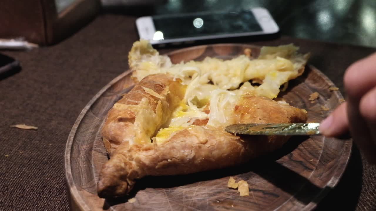 Adjarian Khachapuri Being Eaten