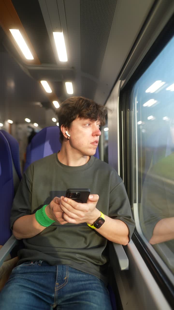 Young Man Traveling by Train