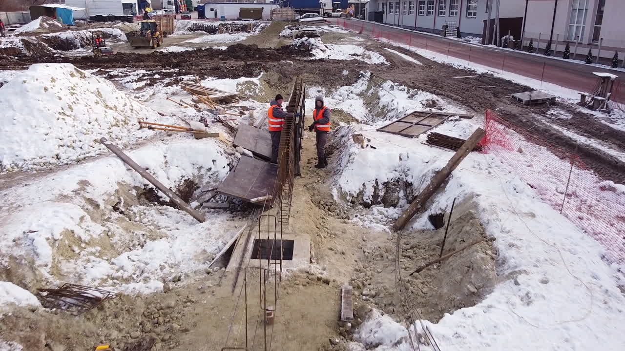 Winter Construction Site with Foundation Work