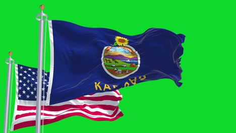 the kansas state flag waving along with the national flag of the united states of america isolated on a green background