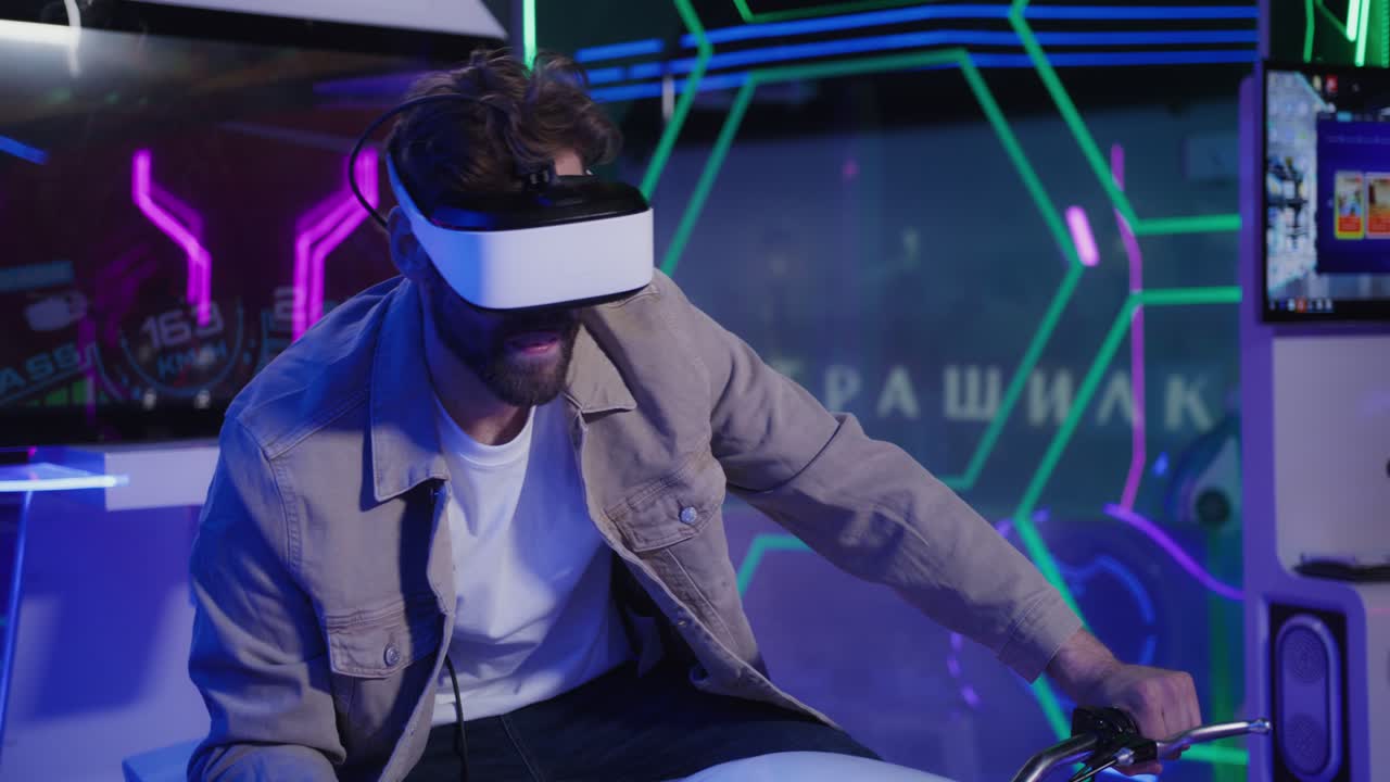 Man Wearing VR Headset Riding a Motorcycle Simulator in an Arcade
