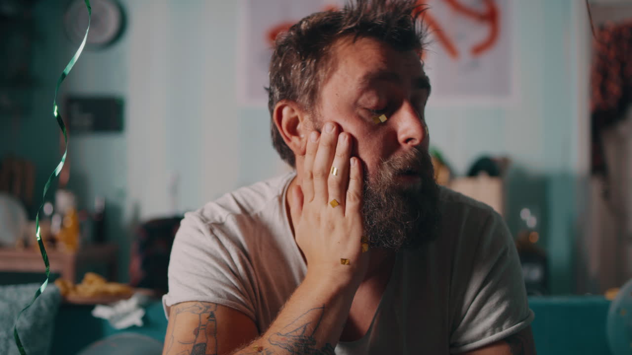 Man's Tired and Exhausted State After a Party