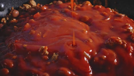 red tomato sauce dripping in pan