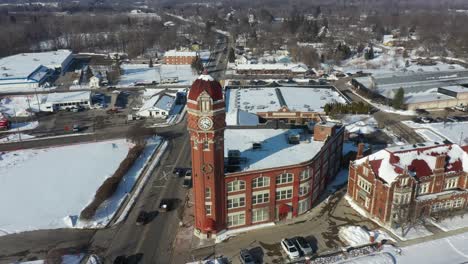 4k aerial chelsea michigan clock in winter