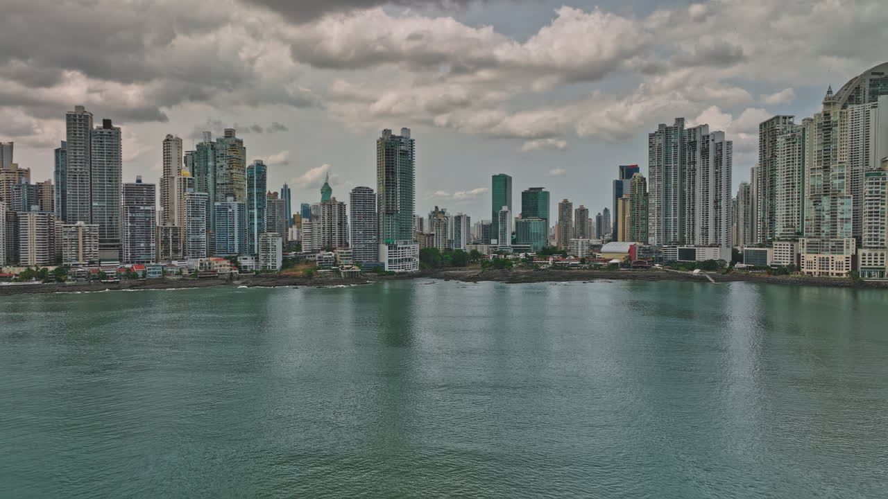 Panama City Aerial v6 pan view capturing downtown cityscape from waterfront punta paitilla and pacifica towards man-made ocean reef islands with private marina - Shot with Mavic 3 Cine - March 2022