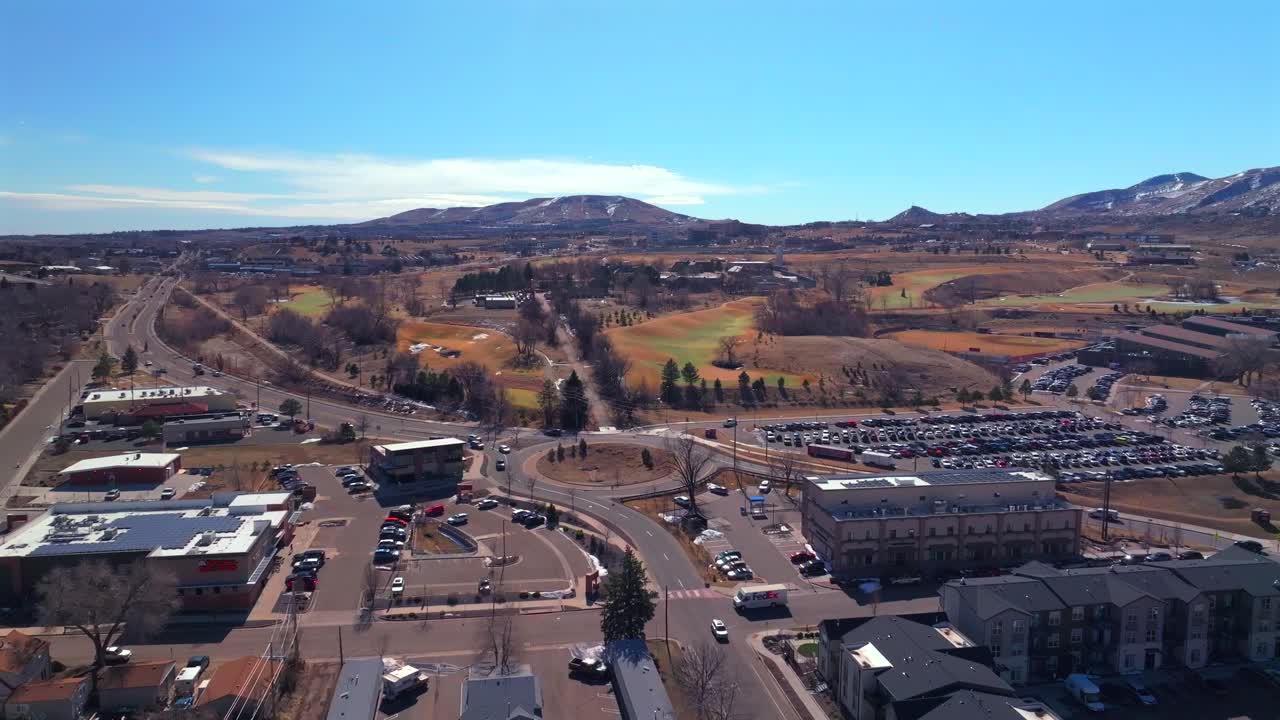 Snowy Lookout Mountain Morrison Golden High School Colorado aerial drone Colorado Fossil Trace Golf Club Jefferson County historic downtown winter sunny morning afternoon blue sky homes upwards motion