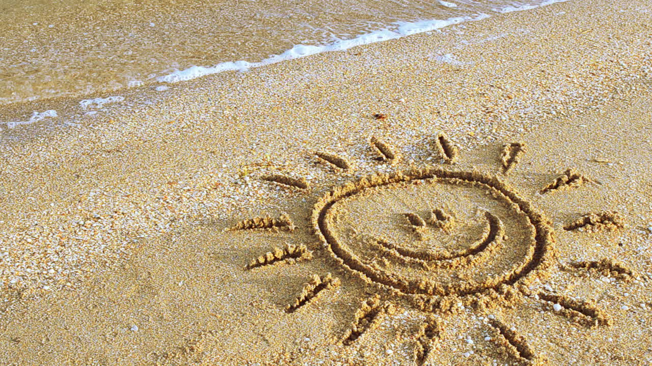Sun drawing on the beach. Beach and drawing