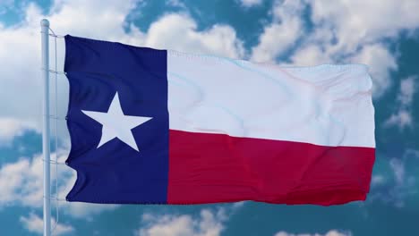 texas flag on a flagpole waving in the wind, blue sky background