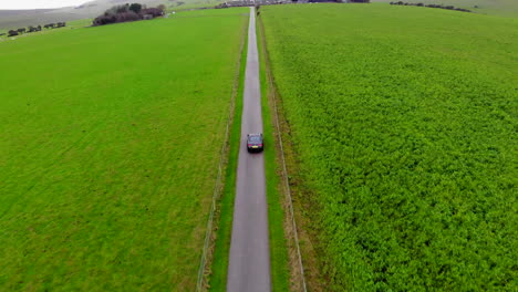 dji mavic air drone follows car in the countryside