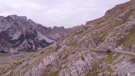 Forward-flying-shot-of-Durmitor-National-Park-Montenegro-with-clouds,-aerial