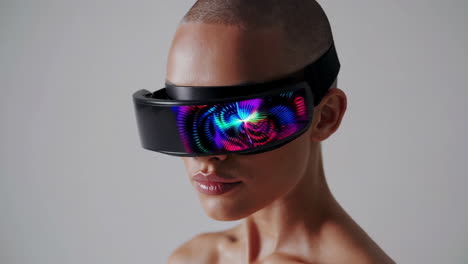 person wearing a futuristic vr/ar headset with colorful digital display