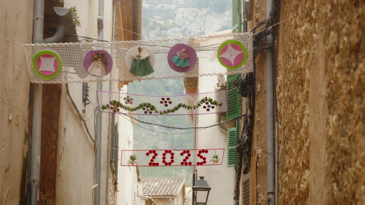Charming Soller street with festive handmade decorations in Mallorca. Perfect for travel documentaries or cultural features.