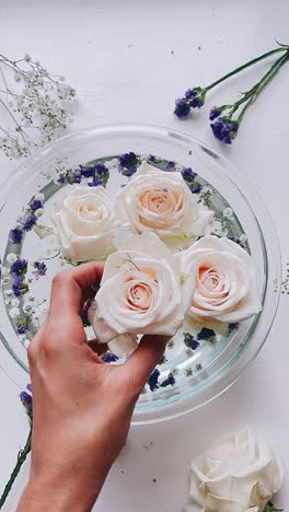 floating roses in a glass bowl